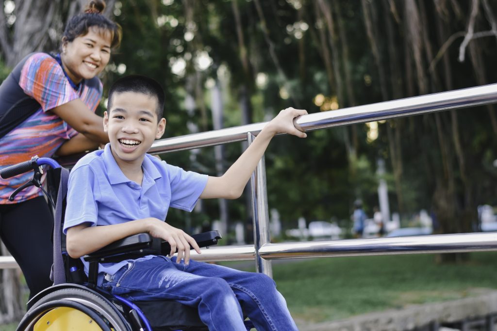 A woman and a child on a wheelchair