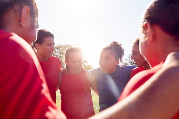 Coach with athletes