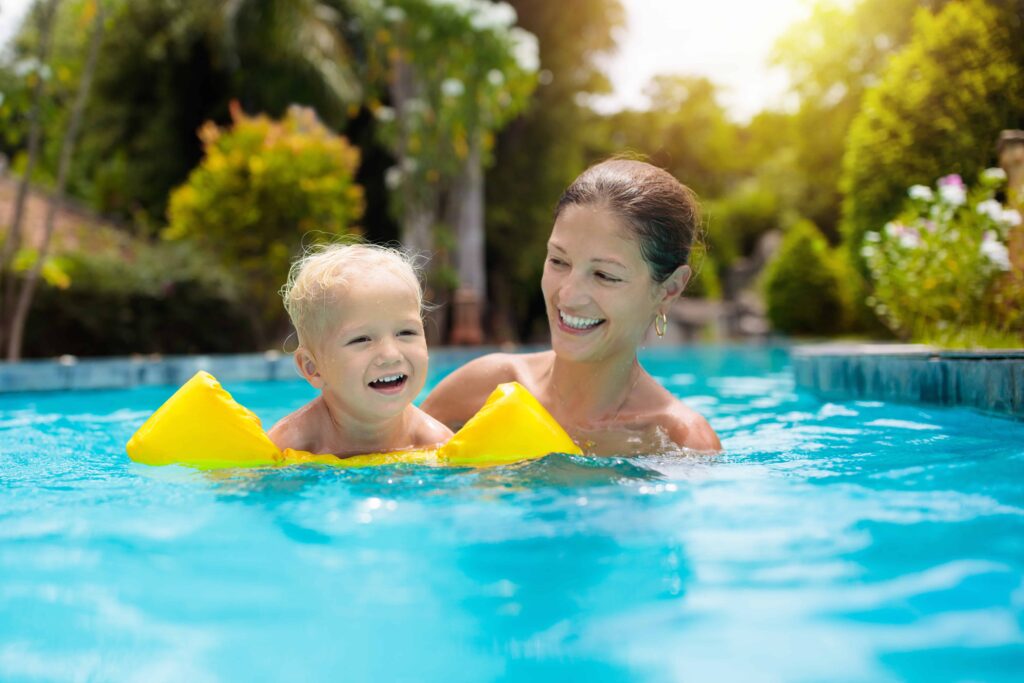 Mom swimming with baby small