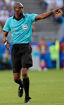 World Cup Referee making a call in game